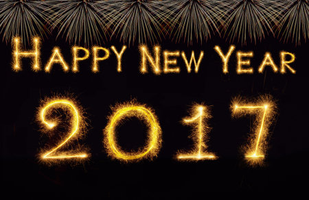 Happy new year 2017 written with Sparkle firework on black background, celebration and greeting...