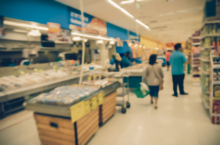 Abstract blurred photo of store with trolley in department store bokeh backgroundの写真素材