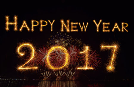 Happy new year 2017 written with Sparkle firework on black background, celebration and greeting...