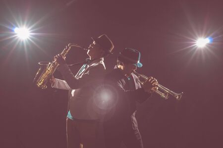 Musician Duo band playing the Trumpet with spot light and lens flare on the stage, musical conceptの写真素材