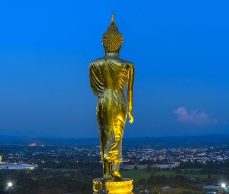 Buddha standing on a mountain at twilight time at Wat Phra That Khao Noi, Nan Province, Thailand, public domainの写真素材