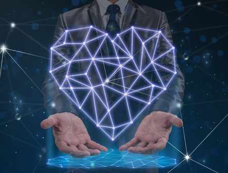 Double exposure of Businessman hand holding the polygonal heart shape writing by lines and dots with shadow over the Technology connection background, physician conceptの写真素材