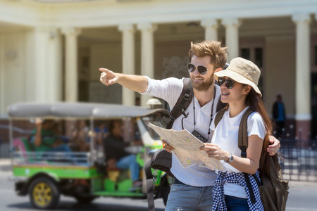 Multi-ethnic Travelers are looking the destination and holding the map at the train stationの写真素材