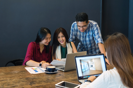 Group Of Asian Business people with casual suit brainstrom Meeting with technology equipment In the modern coffee shop, business group conceptの写真素材