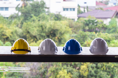 multicolor safety helmet on the table, construction safety hats for technician, worker and engineer,...