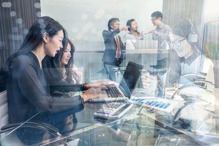 Group Of Asian and Multiethnic Business people with casual suit working and talking together in the modern Office, people business group and entrepreneurship concept.の写真素材
