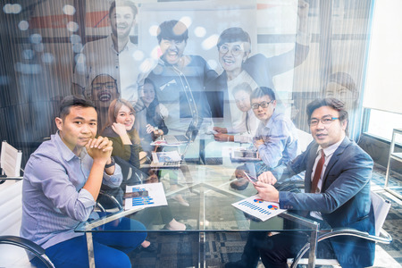 Group of asian Business team having video conference with monitor display in the modern conference room, people business group and entrepreneurship concept.の写真素材