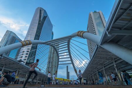 BANGKOK - JUNE 19, 2015: Undefined People are walking on the pedestrian bridge after worked which is Bangkok landmark at Chongnonsi SkyBridge on June 19, 2015 in Bangkok, Thailand.のeditorial素材