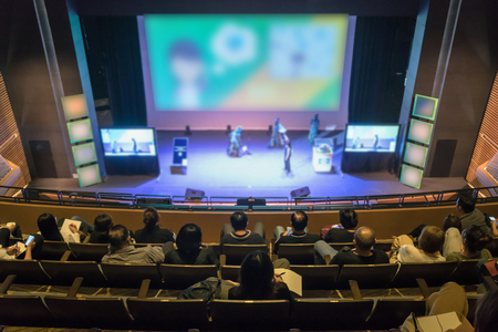 Speakers on the stage with Rear view of Audience in the conference hall or seminar meeting, business and education about investment conceptのeditorial素材