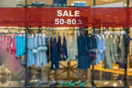 Sale 50-80% off mock up advertise display frame setting over the Abstract blurred photo of clothing...