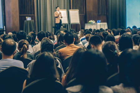 Abstract blurred photo of conference hall or seminar room with attendee background
