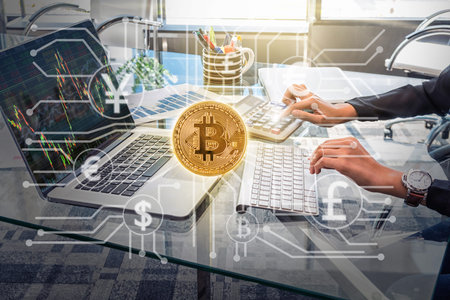 Businesswoman working with calculator, business document and laptop computer notebook with Bitcoins...