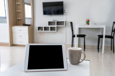 Luxury Interior living room with workspace working with technology tablet, Studio room type of condominium or apartment, service apartment and Accommodations Conceptの写真素材