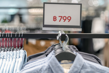Sale off mock up advertise display frame setting over the clothes line in the shopping department store for shopping, business fashion and advertisement conceptの写真素材