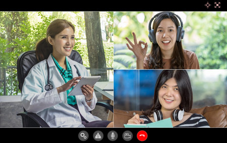 Video conference of asian woman giving consult to group of asia people and teamwork colleague to...
