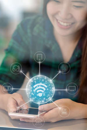 Asian businesswoman hand using the smart mobile phoneの写真素材