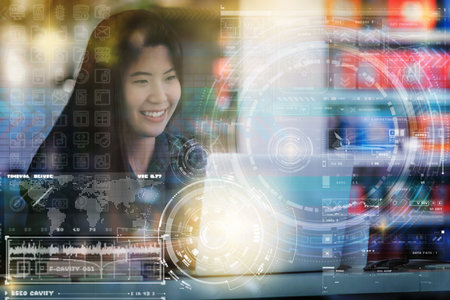 Multi exposure of Closeup Asian businesswoman hand using the laptop with digital display screen of...
