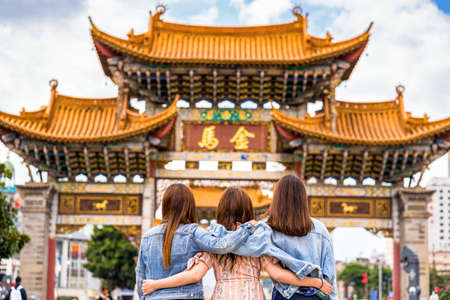 back side of Three asian happiness women walking and sightseeing together when travelling over the...