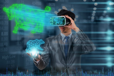 Asian Businessman using virtual reality glassed and hand holding Bull and Bear polygonal shape...