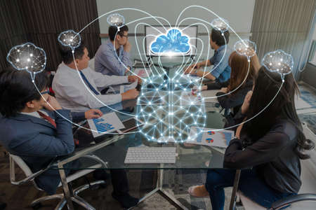 Group Of Asian and Multiethnic Business people brainstorming and working with brain and virtual screen connecting with cloud technolog in the modern workplace, business group and technology conceptの写真素材