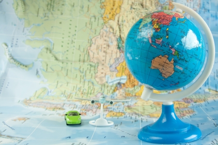 travel  concept with terrestrial globe, plane a luxury carの写真素材