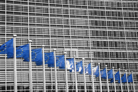European Union flags against the European Parliament building