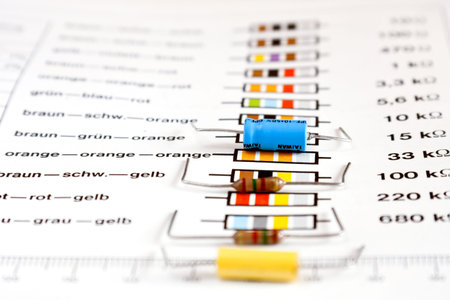 electronic resistors on a book with circuit symbols 