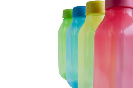 colorful plastic water containers isolated on white の写真素材