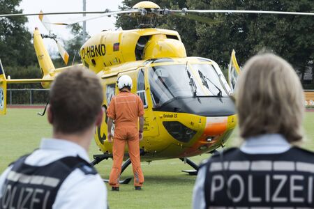 German police officers assisting an ADAC helicopterのeditorial素材