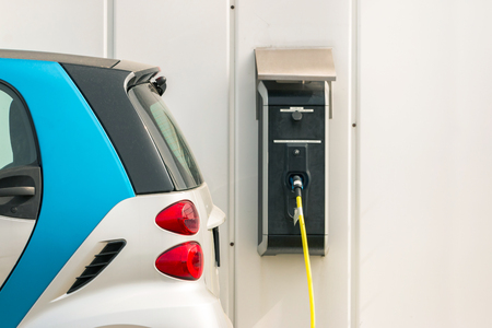 Electric car at the charging stationの写真素材