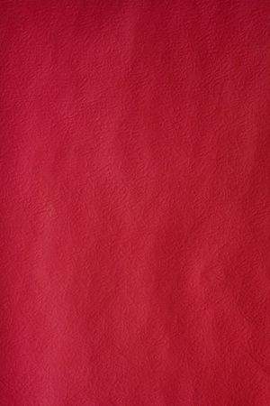 dark red background with a soft paper textureの写真素材