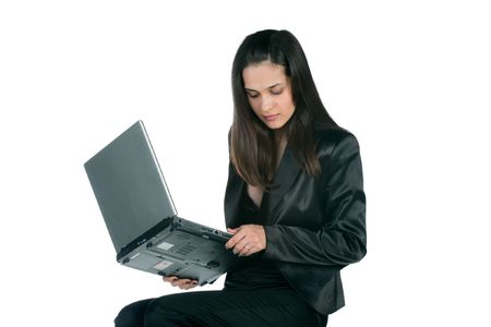 young pretty business woman working on laptop very expressive - isolated on white backgroundの写真素材