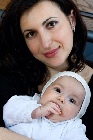 happy family home: mother and baby girl