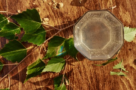 Glasses of birch sap juice birch branches on wooden table background. Healthy and vitamin food spring useful vitamin nutrition fresh drink.の写真素材