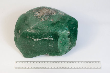 Big natural stone green amber white backgroundの写真素材