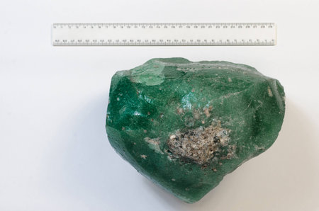 Big natural stone green amber white backgroundの写真素材