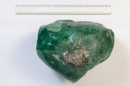 Big natural stone green amber white backgroundの写真素材