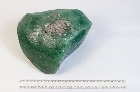Big natural stone green amber white backgroundの写真素材