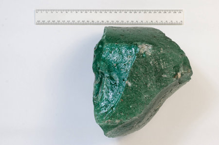 Big natural stone green amber white backgroundの写真素材