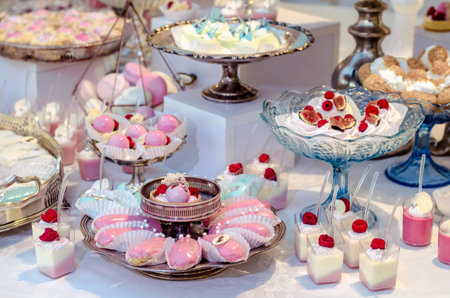 Delicious wedding reception candy bar dessert table full with panacota and edible silver. Luxury life.の写真素材