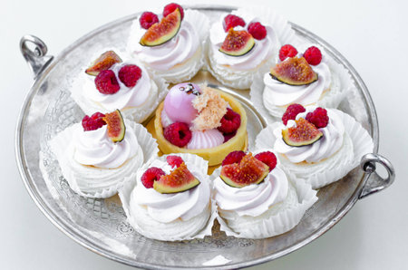 Candy Bar. Delicious homemade dessert meringue with figs and raspberries for christmas or new year on silver plate.の写真素材