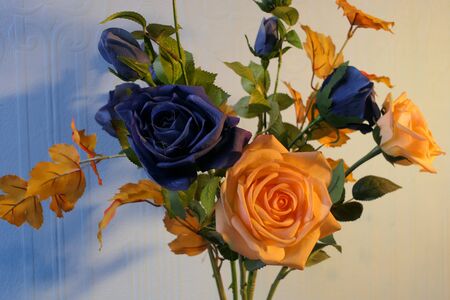 A sprig of beautiful artificial flowers and leaves.の写真素材
