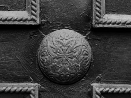 An openwork detail enclosed in the decorative part of the door in the shape of a cross.の写真素材