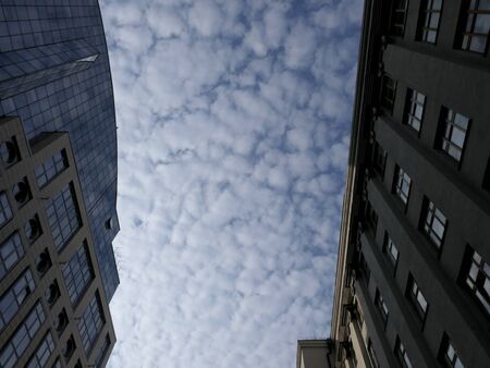 Between 2 houses wonderful clouds hung.の写真素材