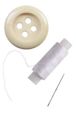 thread, button and needle under the white background