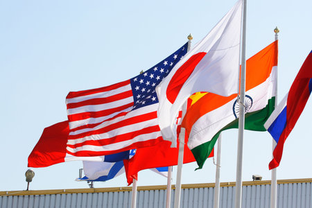 Flags of several countreies against the light sky