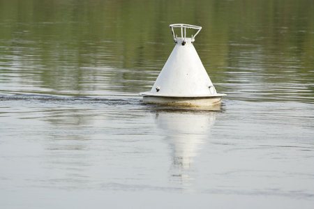 a buoy against a waterの写真素材
