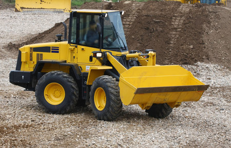 The image of bulldozer under the white background