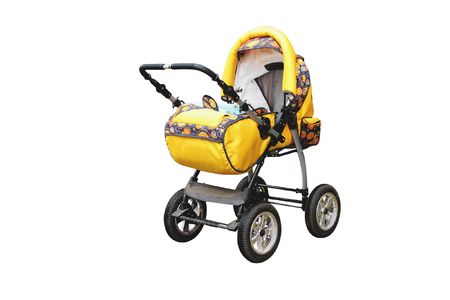 The image of yellow perambulator under the white backgroundの写真素材