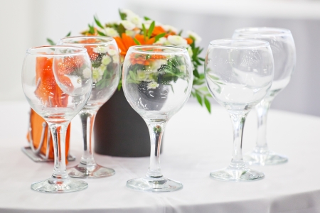 wineglass and a flower on a tableの写真素材